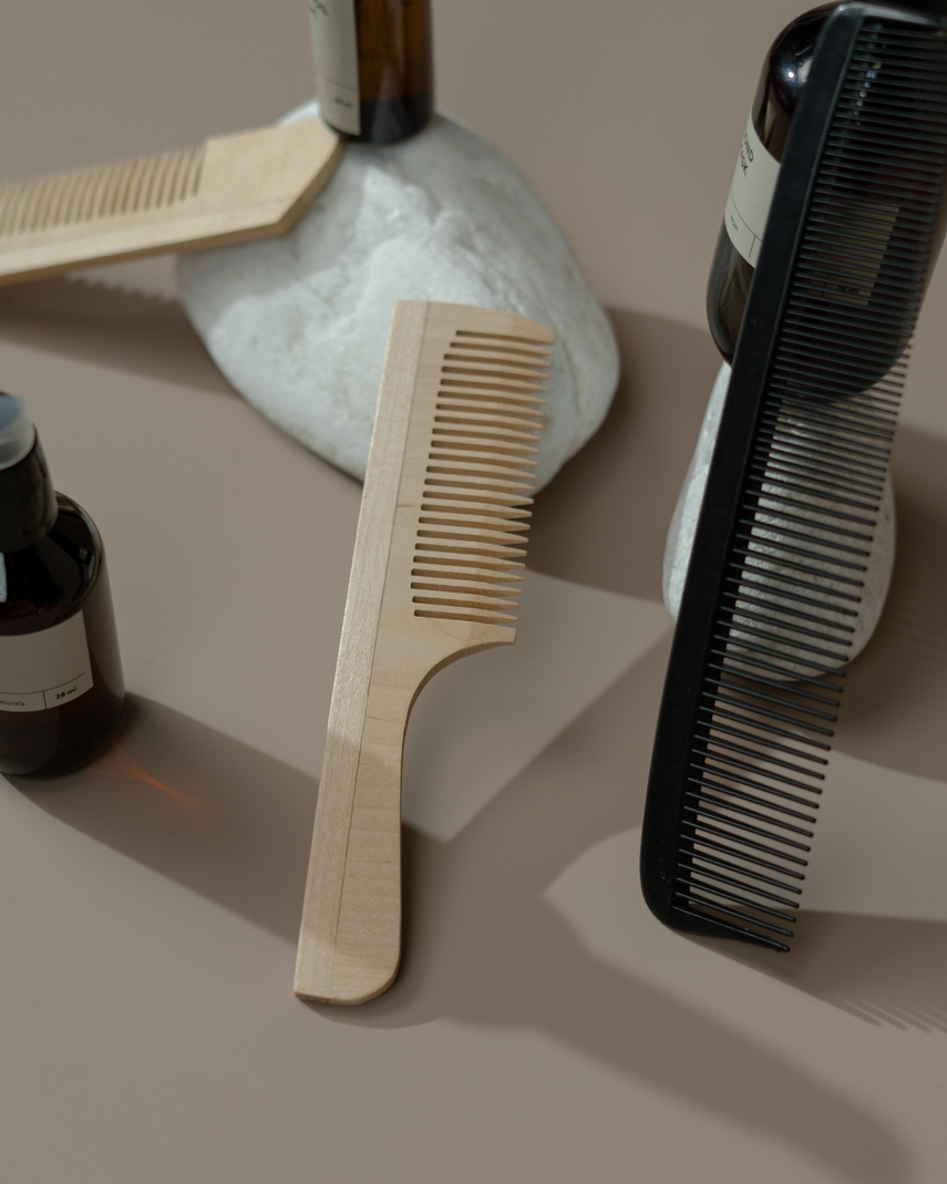 Close-Up Shot of Wooden and Plastic Hair Combs